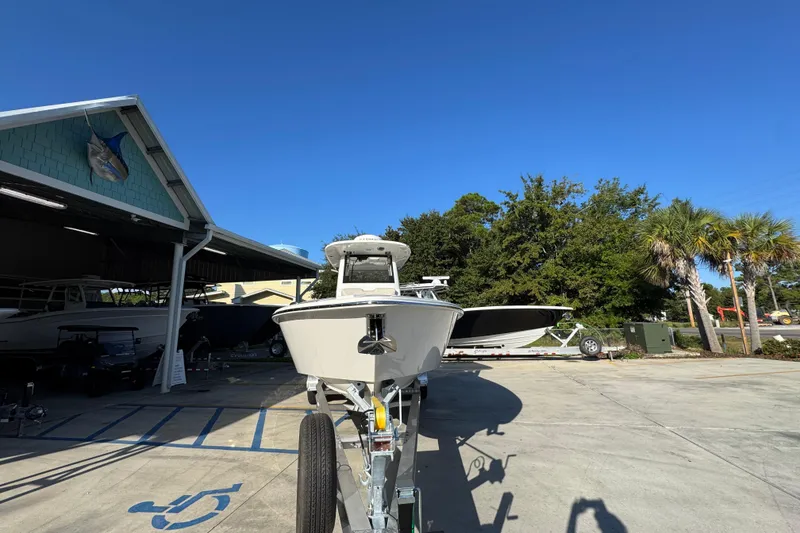 Slide: The Image of 2026 Solace 28 HCS boat on trailer in sunny outdoor setting. - 6