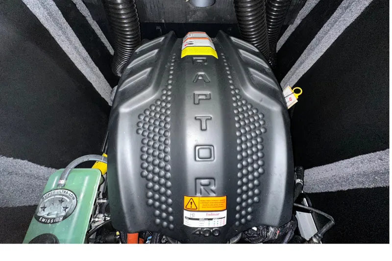 Slide: The Image of 2024 Supra SV 400 boat cruising on a scenic lake with lush green shoreline. - 11