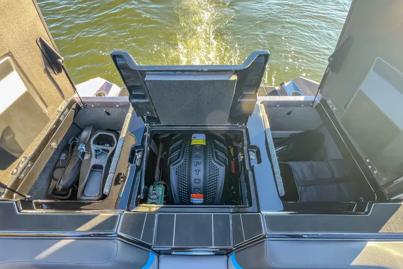 Slide: The Image of 2024 Supra SV 400 boat engine compartment with storage and Raptor engine visible. - 18