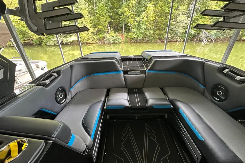 Slide: The Image of 2024 Supra SV 400 boat cruising on open water, showcasing sleek design and performance. - 3