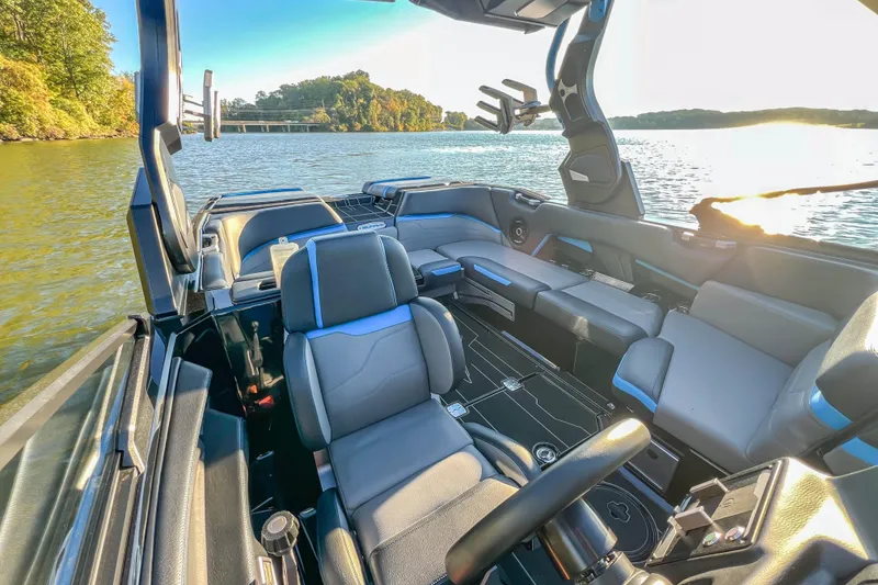 Slide: The Image of 2024 Supra SV 400 boat interior with luxurious seating on a sunny lake. - 33