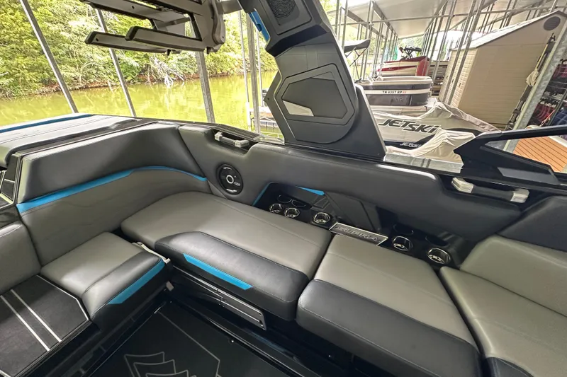 Slide: The Image of 2024 Supra SV 400 boat cruising on water, featuring sleek blue design and modern amenities. - 4