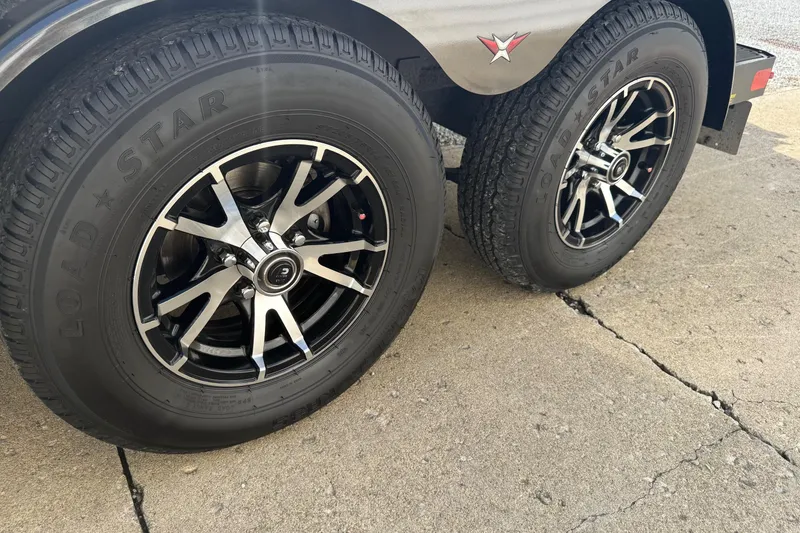 Slide: The Image of 2022 Vexus AVX1980 trailer wheels with Load Star tires on concrete surface. - 16