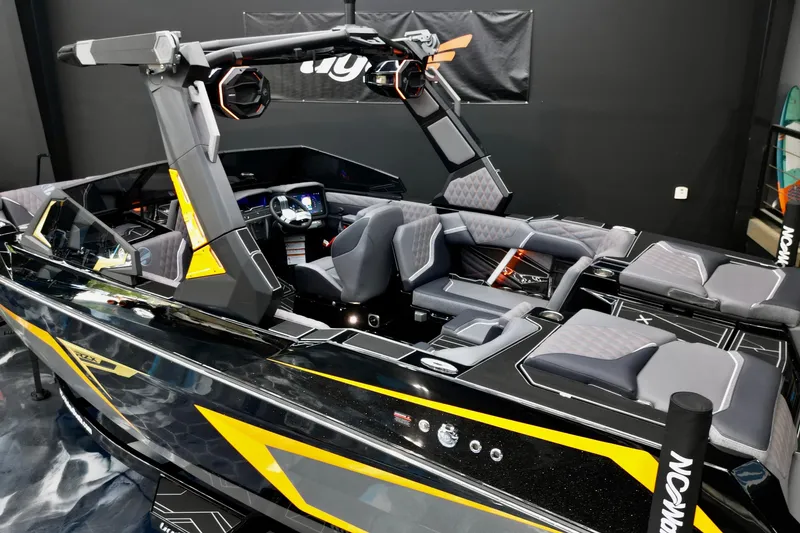 Slide: The Image of 2026 Tigé 22RZX boat with sleek black and yellow design, luxurious seating, and advanced controls. - 16