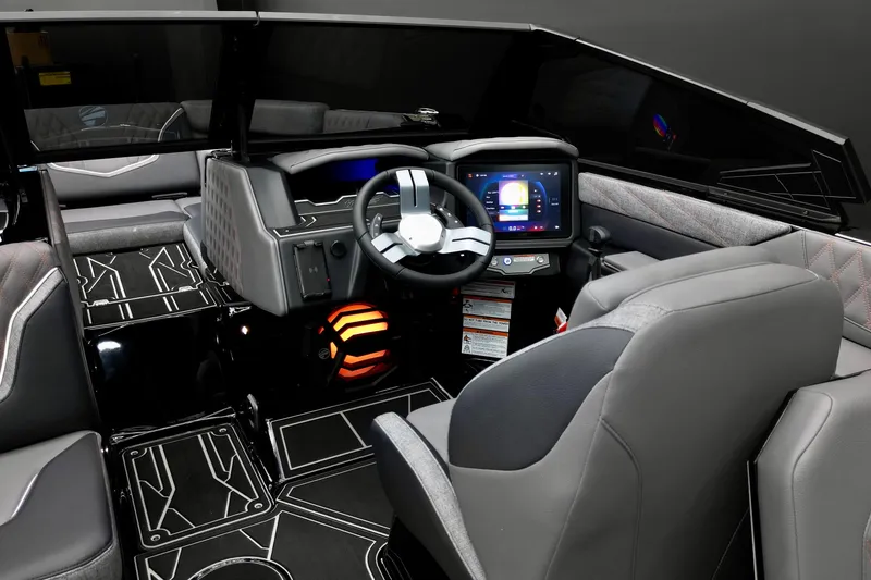 Slide: The Image of Interior of 2026 Tigé 22RZX boat with modern dashboard and sleek seating. - 17
