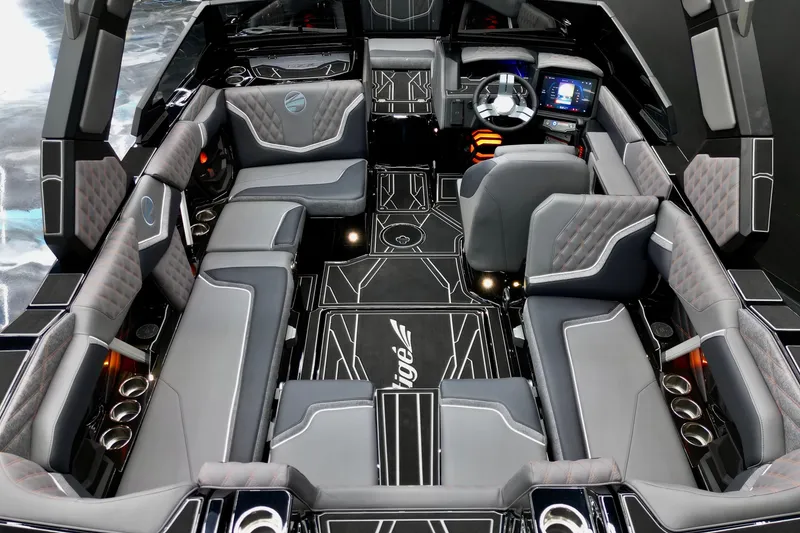 Slide: The Image of Luxurious interior of 2026 Tigé 22RZX boat with modern seating and advanced dashboard. - 19