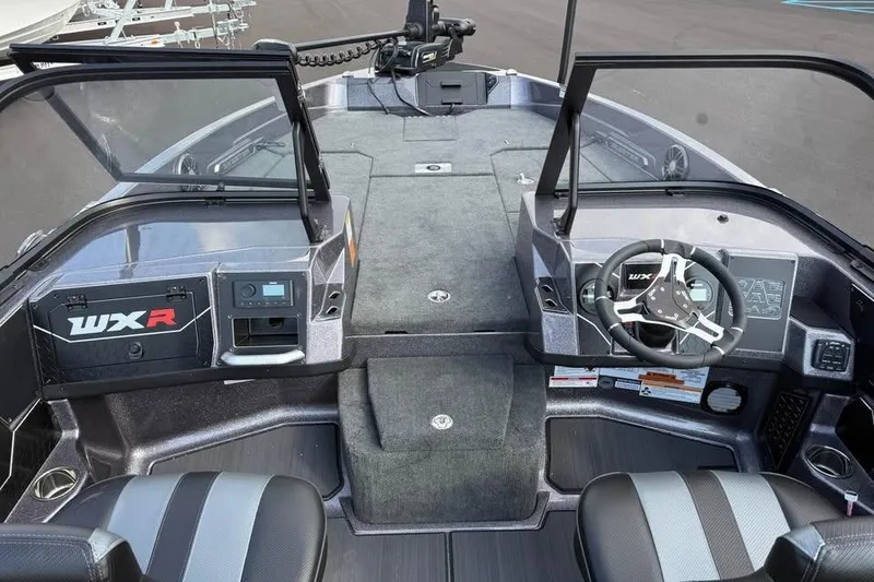 Slide: The Image of 2026 Skeeter WXR2060 boat interior with modern dashboard and steering wheel. - 13