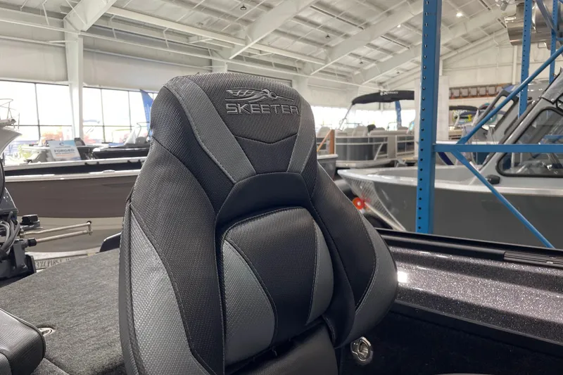 Slide: The Image of Skeeter WXR2060 boat seat in showroom, showcasing modern design and comfort, 2026 model. - 15