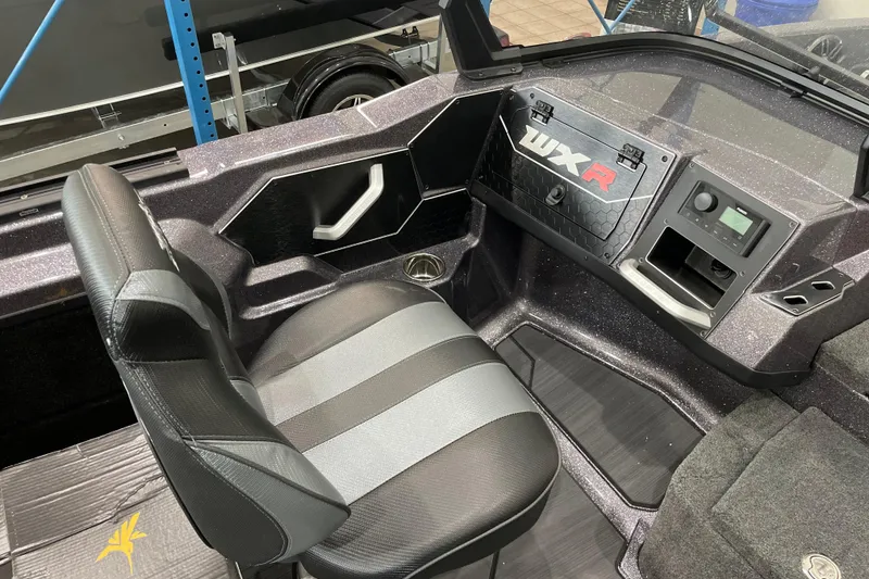 Slide: The Image of 2026 Skeeter WXR2060 boat interior with sleek seating and modern dashboard design. - 18