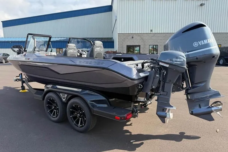 Slide: The Image of 2026 Skeeter WXR2060 boat with Yamaha outboard motors on a trailer. - 2