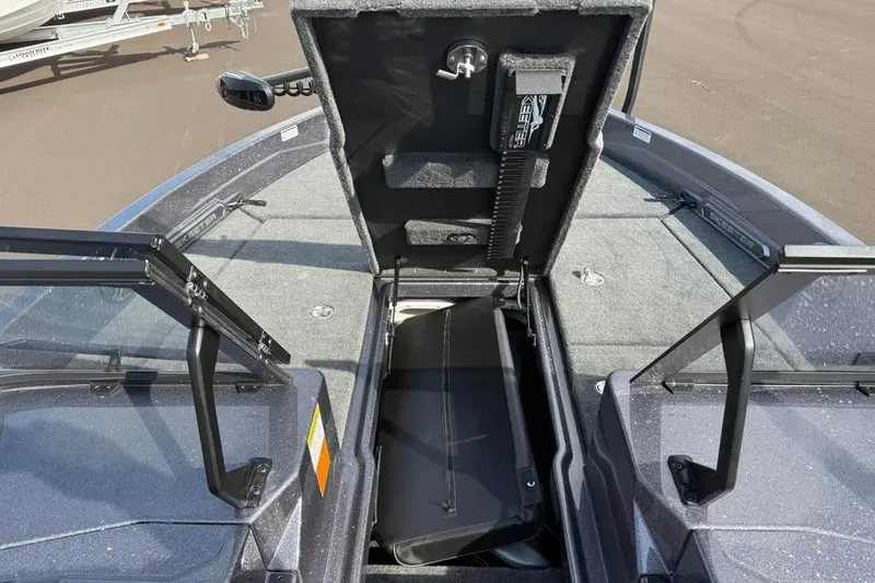 Slide: The Image of Open storage compartment on 2026 Skeeter WXR2060 boat, showcasing interior features. - 21