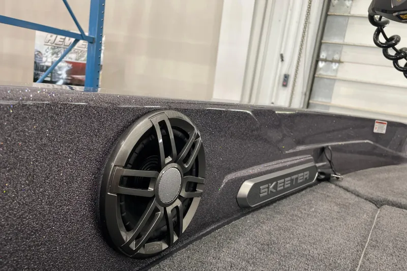 Slide: The Image of 2026 Skeeter WXR2060 boat interior with speaker and logo detail. - 24