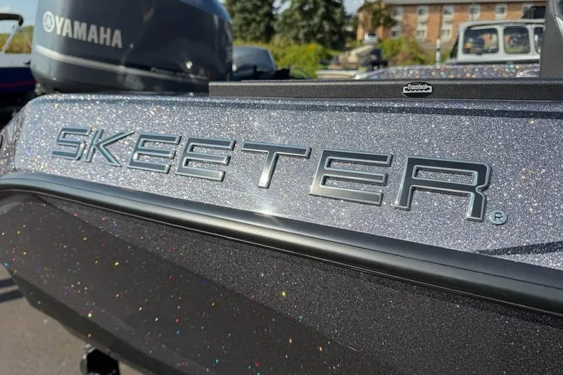 Slide: The Image of Close-up of 2026 Skeeter WXR2060 boat with Yamaha engine in background. - 27