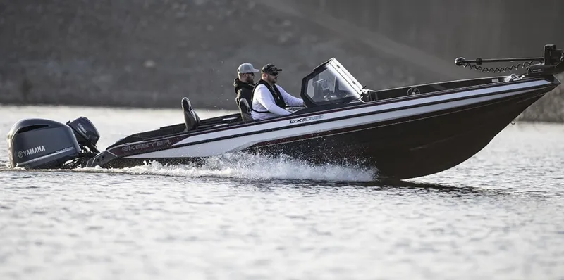 Slide: The Image of Manufacturer Provided Image: 2026 Skeeter WXR2060 boat cruising on water with Yamaha engine. - 30