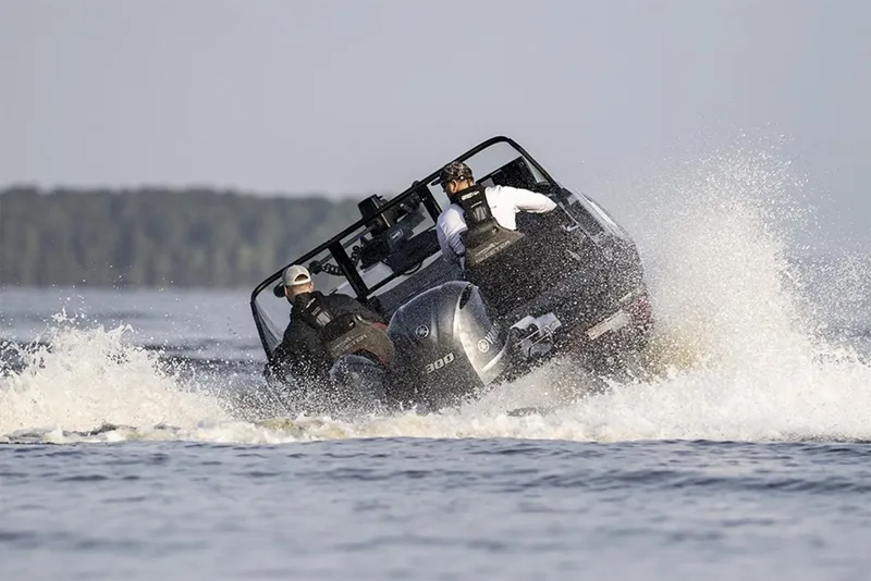 Slide: The Image of Manufacturer Provided Image: Two people riding a 2026 Skeeter WXR2060 boat on a lake, creating a splash. - 33