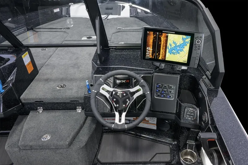 Slide: The Image of Manufacturer Provided Image: 2026 Skeeter WXR2060 boat cockpit with advanced navigation system and sleek steering wheel design. - 38
