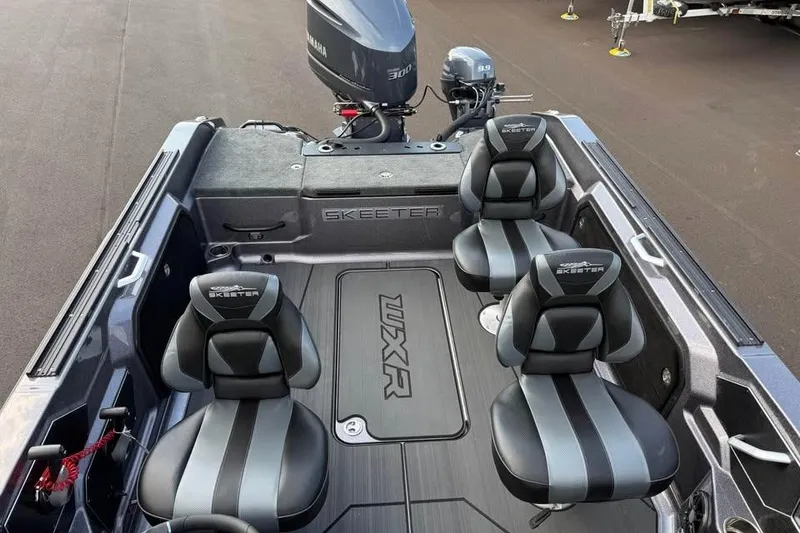 Slide: The Image of 2026 Skeeter WXR2060 boat interior with four seats and Yamaha outboard motor. - 7