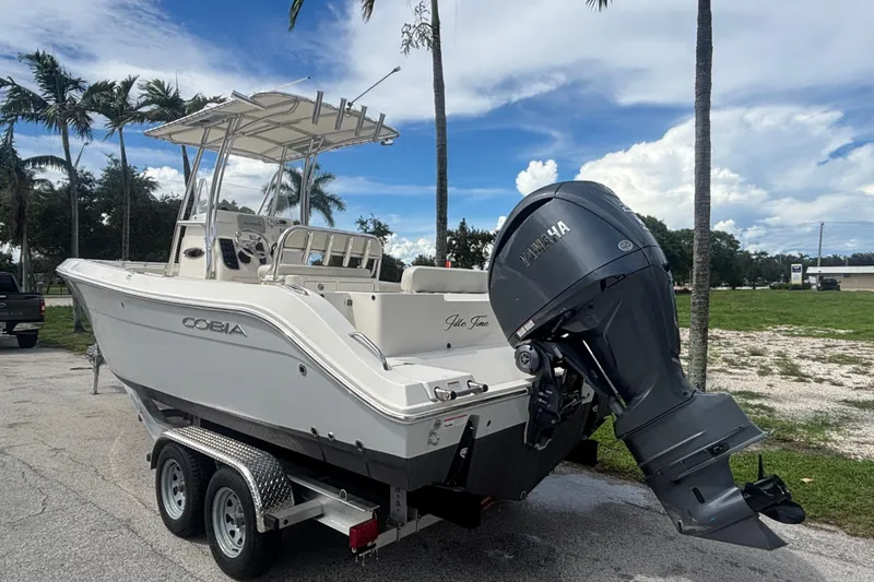 Slide: The Image of 2022 Cobia 237 Center Console boat on trailer with Yamaha outboard motor. - 3