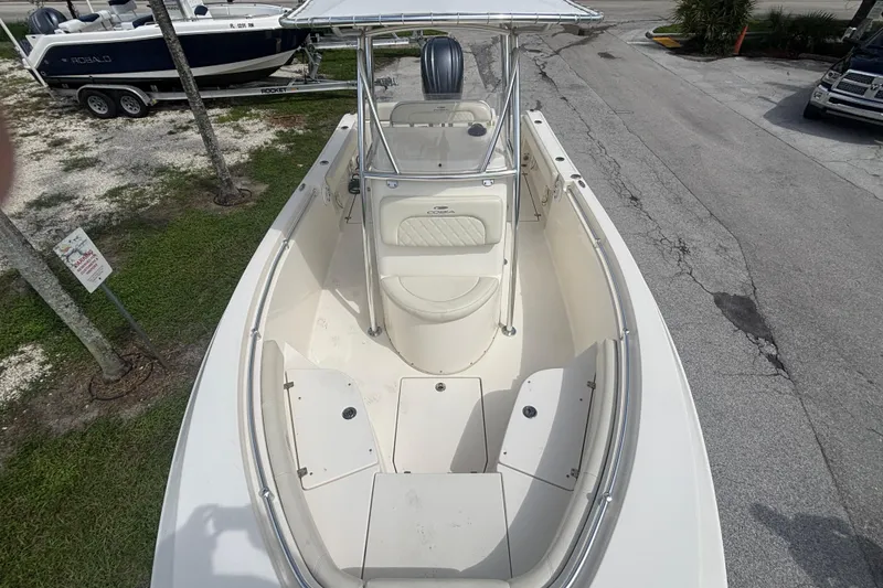 Slide: The Image of 2022 Cobia 237 Center Console boat with spacious seating and sleek design. - 8
