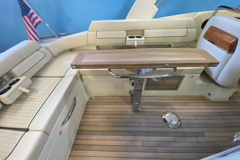 Slide: The Image of Luxurious interior of 2026 Chris-Craft Launch 31 GT boat with elegant seating and wooden table. - 6
