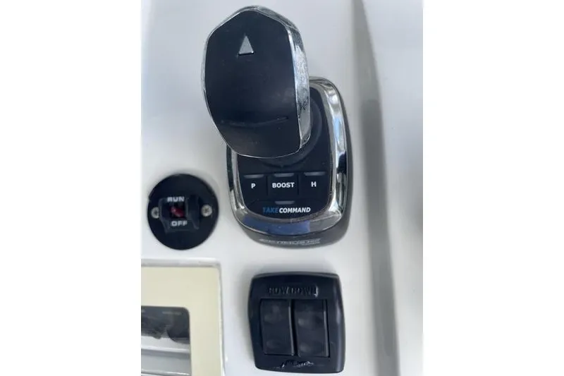 Slide: The Image of Control panel of 2022 SeaVee 370z boat with joystick and switches. - 21