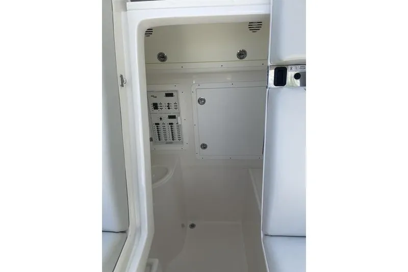 Slide: The Image of Interior view of 2022 SeaVee 370z boat, featuring control panels and storage compartments. - 27