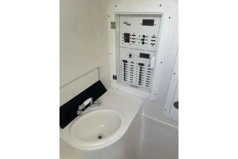 Slide: The Image of Control panel and sink in 2022 SeaVee 370z boat interior. - 28
