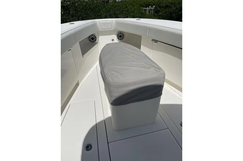 Slide: The Image of 2022 SeaVee 370z boat interior with covered seating and speakers. - 34