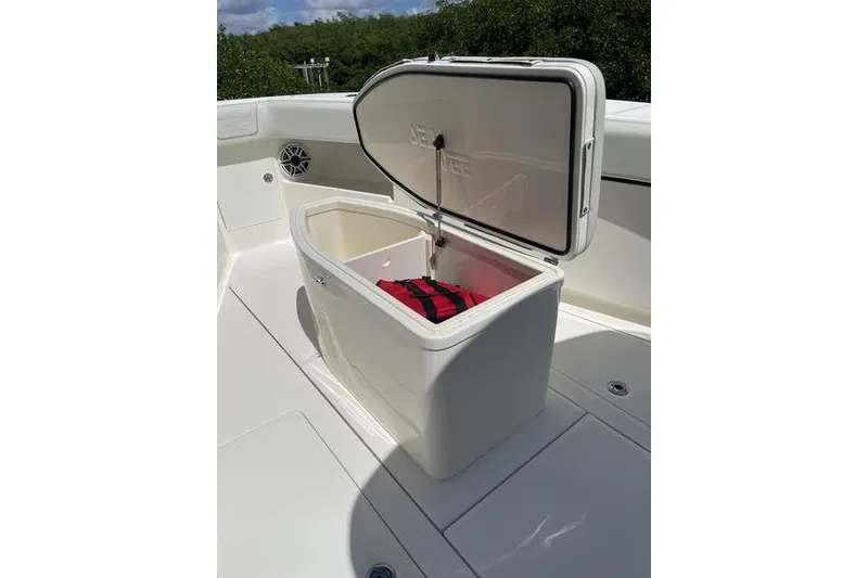 Slide: The Image of Open storage compartment on 2022 SeaVee 370z boat with red bag inside. - 36