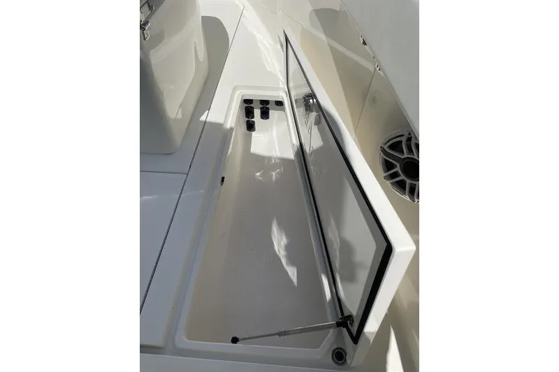 Slide: The Image of 2022 SeaVee 370z boat storage compartment with open lid and speaker. - 38