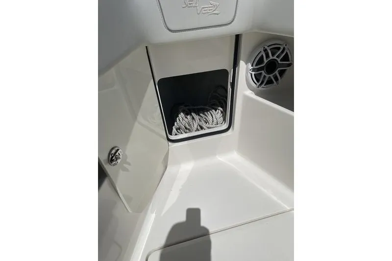 Slide: The Image of 2022 SeaVee 370z boat storage compartment with rope and speaker detail. - 40