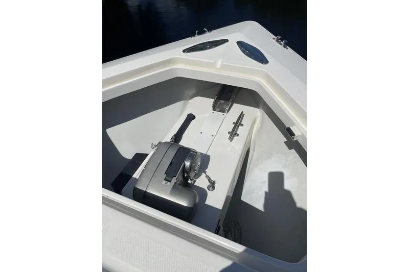 Slide: The Image of 2022 SeaVee 370z boat anchor compartment with winch and cleat. - 41