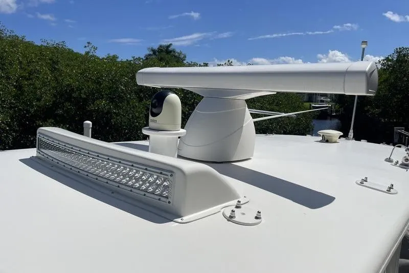 Slide: The Image of Radar and camera equipment on 2022 SeaVee 370z boat under clear blue sky. - 42