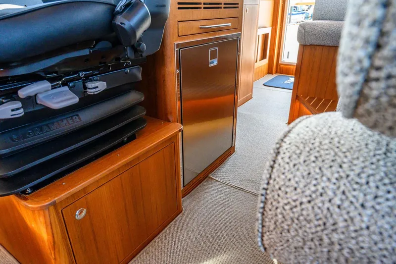 Slide: The Image of Interior of 2024 Targa 37 boat with wooden cabinetry and seating. - 11