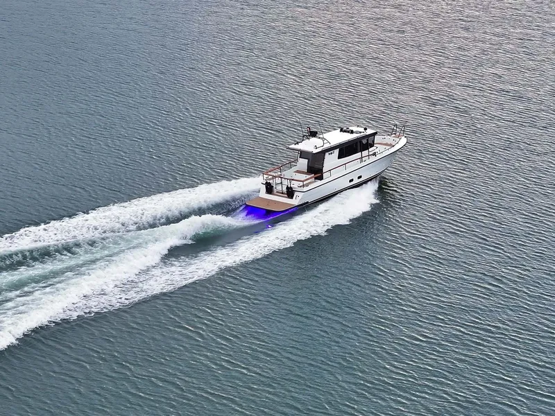 Slide: The Image of 2024 Targa 37 boat cruising on open water, creating a dynamic wake. - 2