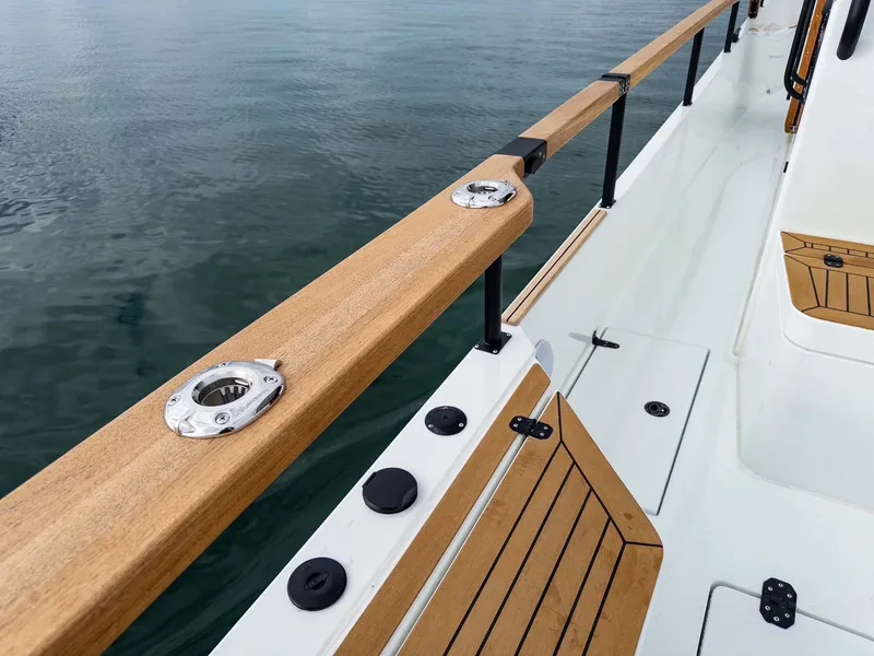 Slide: The Image of 2024 Targa 37 boat deck with wooden railings and sleek design. - 27