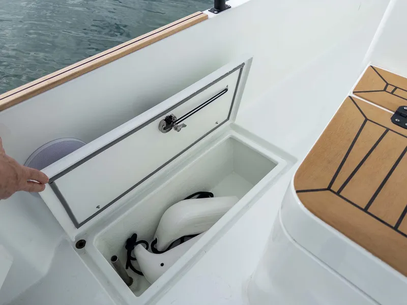 Slide: The Image of Storage compartment on 2024 Targa 37 boat, open with fenders inside. - 28