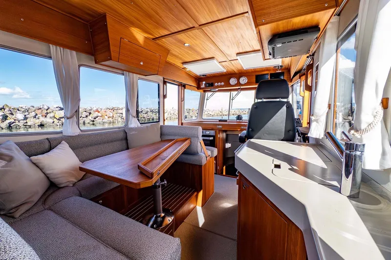 Slide: The Image of Luxurious interior of 2024 Targa 37 boat with wooden accents and comfortable seating. - 4