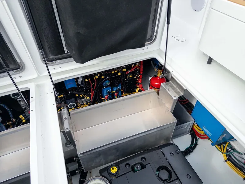 Slide: The Image of Engine compartment of 2024 Targa 37 boat, showcasing mechanical components and wiring. - 44