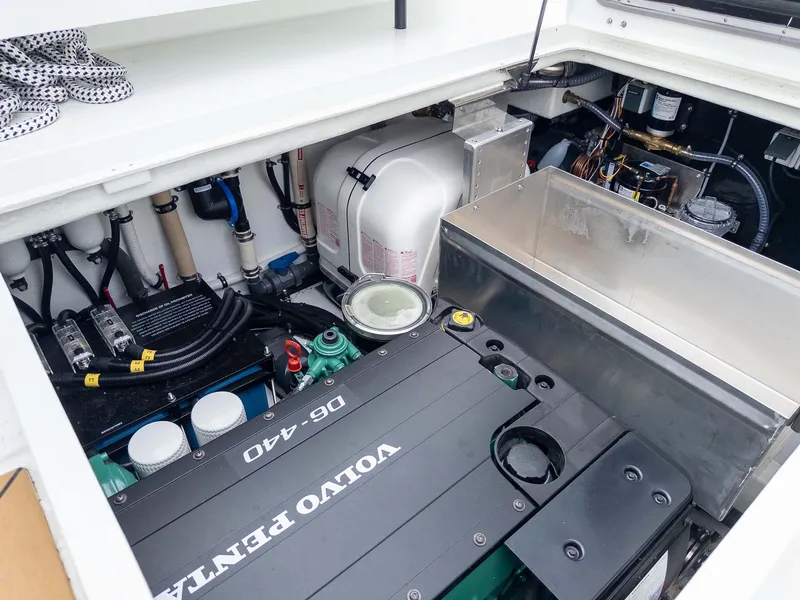 Slide: The Image of Engine compartment of a 2024 Targa 37 boat featuring a Volvo Penta D6-440 engine. - 45