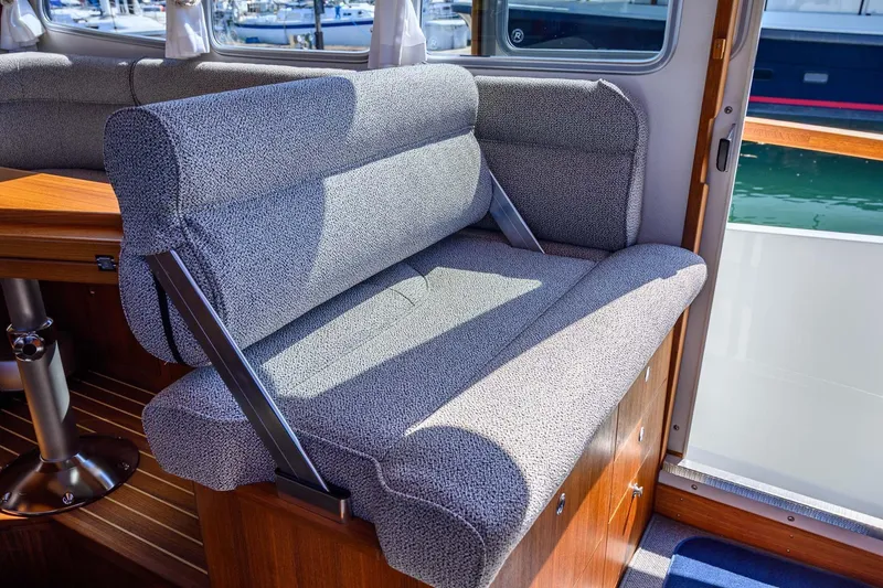 Slide: The Image of 2024 Targa 37 interior with comfortable seating and wooden accents. - 7