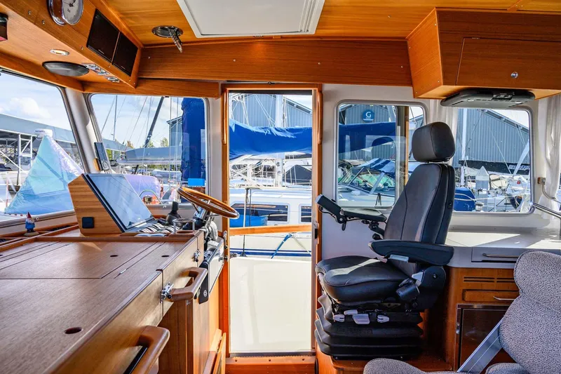 Slide: The Image of Interior of 2024 Targa 37 boat, featuring helm station and luxurious seating. - 9