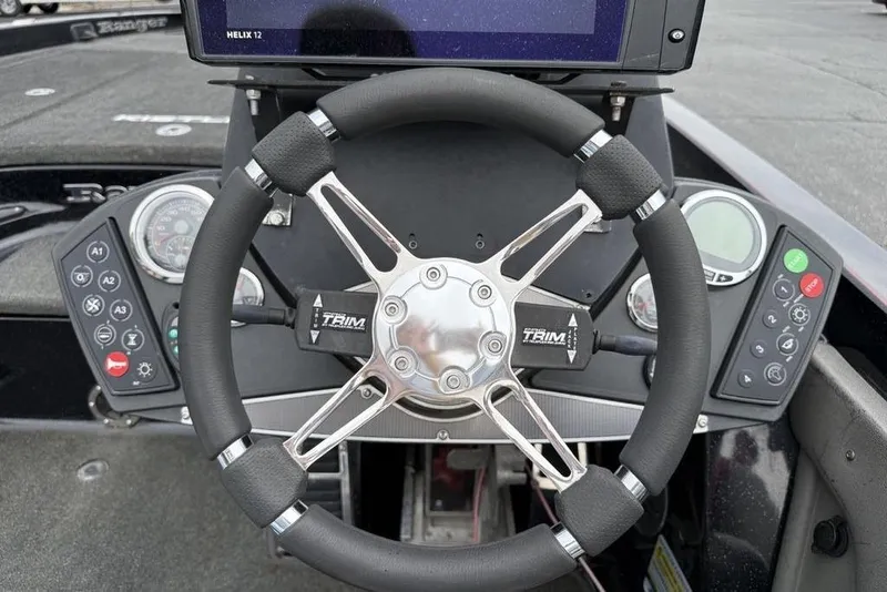 Slide: The Image of Steering wheel of 2015 Ranger Z520 Comanche boat with control panel and gauges. - 14