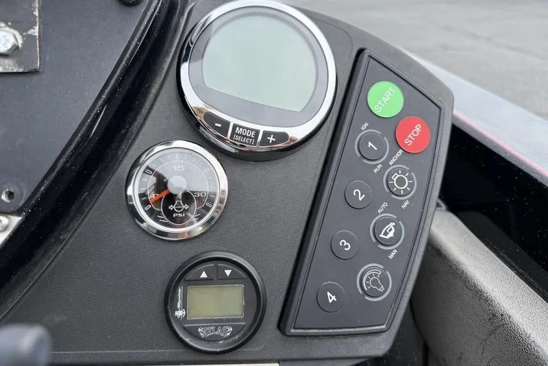 Slide: The Image of Control panel of a 2015 Ranger Z520 Comanche boat with gauges and buttons. - 15