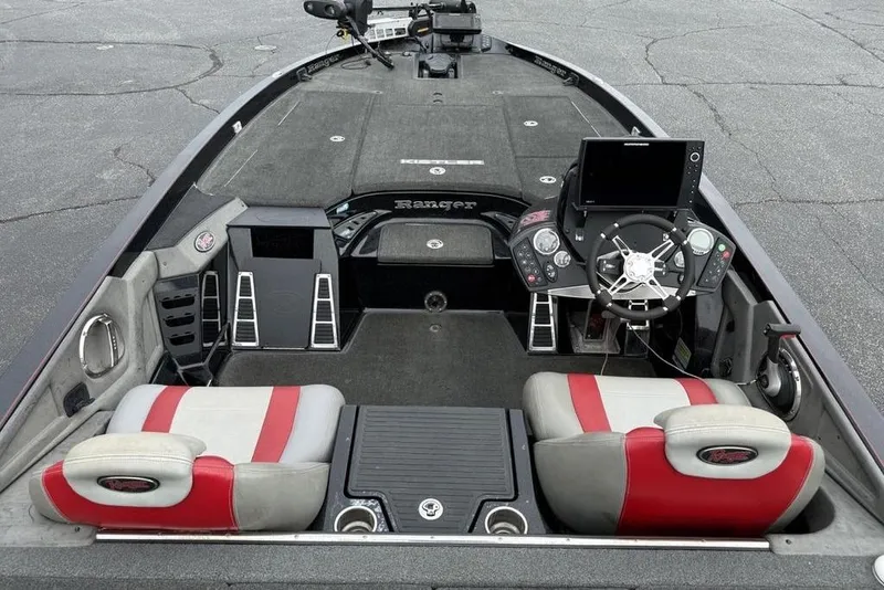 Slide: The Image of 2015 Ranger Z520 Comanche boat interior with dual seats, steering console, and navigation equipment. - 24