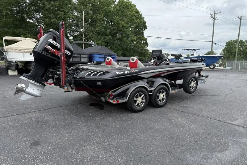Slide: The Image of 2015 Ranger Z520 Comanche boat with Mercury engine on trailer in parking lot. - 5