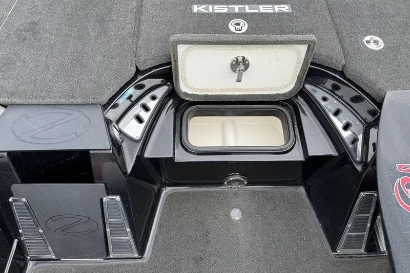 Slide: The Image of 2015 Ranger Z520 Comanche boat deck with storage compartment and Kistler branding. - 8