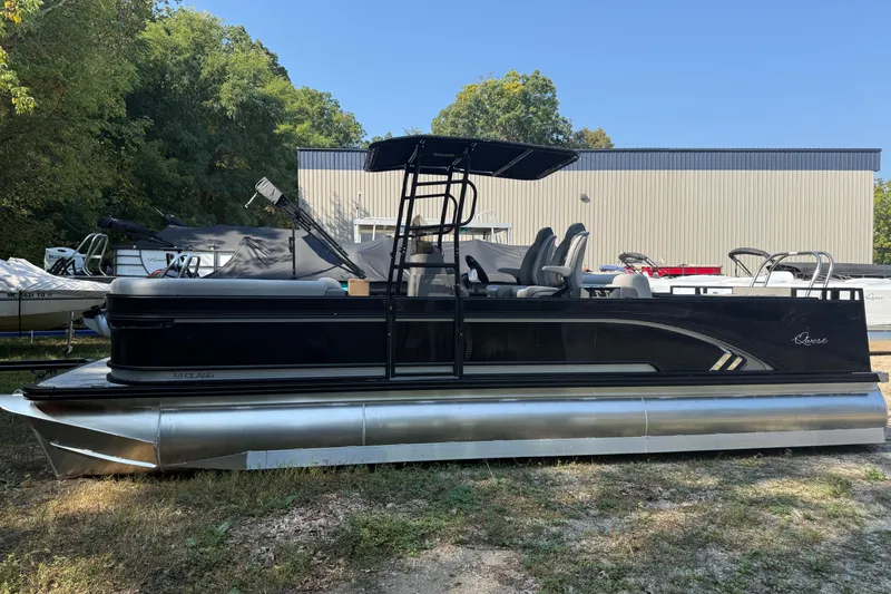 Slide: The Image of 2026 Qwest M-Class 24 Pro Sport pontoon boat parked outdoors. - 3