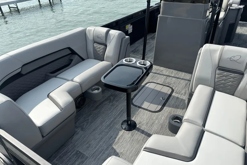 Slide: The Image of Luxurious interior of 2026 Qwest M-Class 24 Pro Sport boat with plush seating and table. - 4