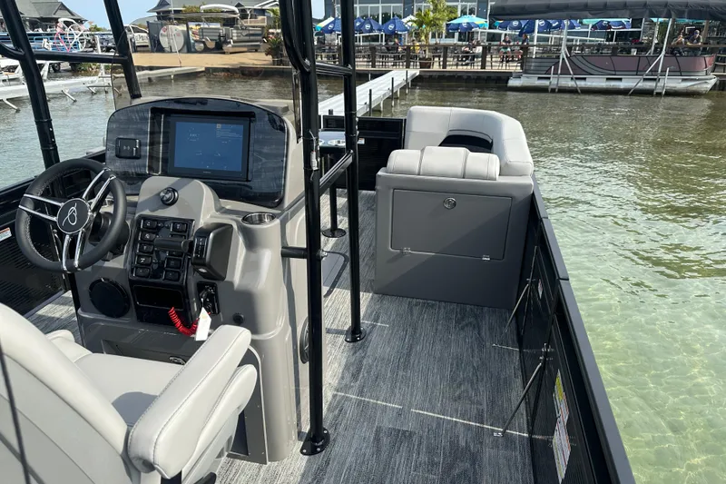 Slide: The Image of 2026 Qwest M-Class 24 Pro Sport boat interior with modern dashboard and seating. - 9